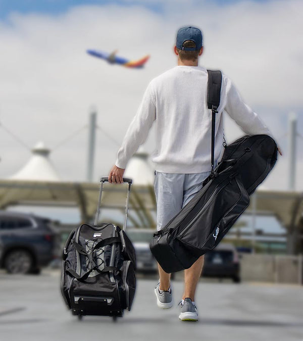 Sunday Golf The Mule Golf Travel Bag in black being carried over the shoulder by a man going to the airport.