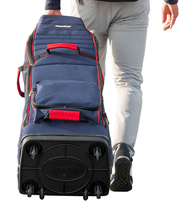 Bagboy Freestyle Travel Cover in Navy/Red being pulled by man