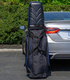 Bag Boy T-10 Travel Bag Cover in Black/Royal resting upright against a car