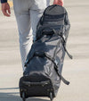 BAG BOY  ZTF Travel Bag Cover in black/charcoal pulled by man.