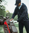 BagBoy Chiller Cart Golf Bag n Charcoal/Red/Black - male golfer getting a can from cooler pouch pocket