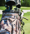 Datrek DG Lite III Golf Cart Bag in Digital Camo - closeup of top area with clubs showing the Dtrek logo on the cart