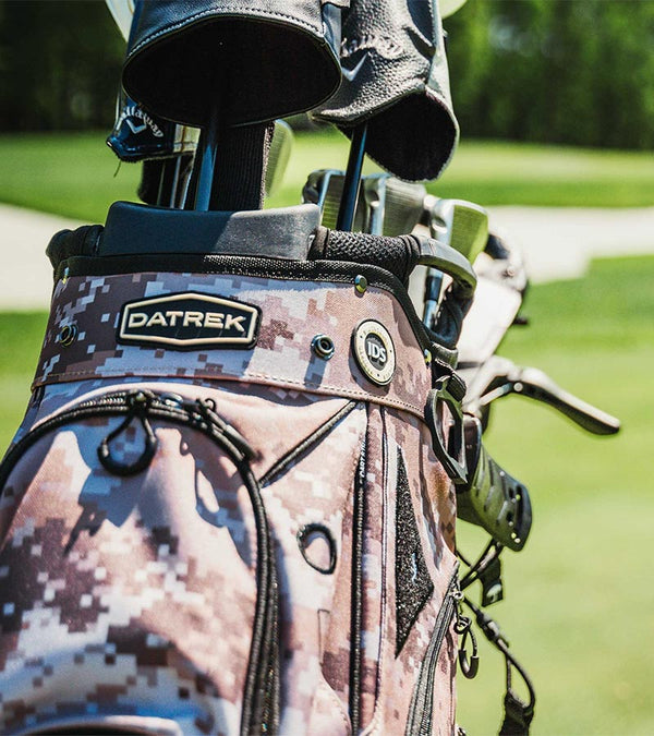 Datrek DG Lite III Golf Cart Bag in Digital Camo - closeup of top area with clubs showing the Dtrek logo on the cart