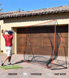 Gosports 10 Ft X 7 Ft Golf Practice Hitting Net- male golfer practicing in front of a garage door on driveway - icons & words saying that the net can be used indoor, and outdoor with a fast setup