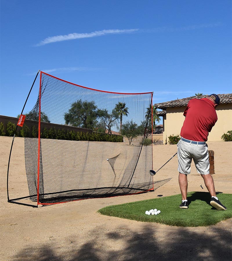 Gosports 10 Ft X 7 Ft Golf Practice Hitting Net- male golfer practicing outside