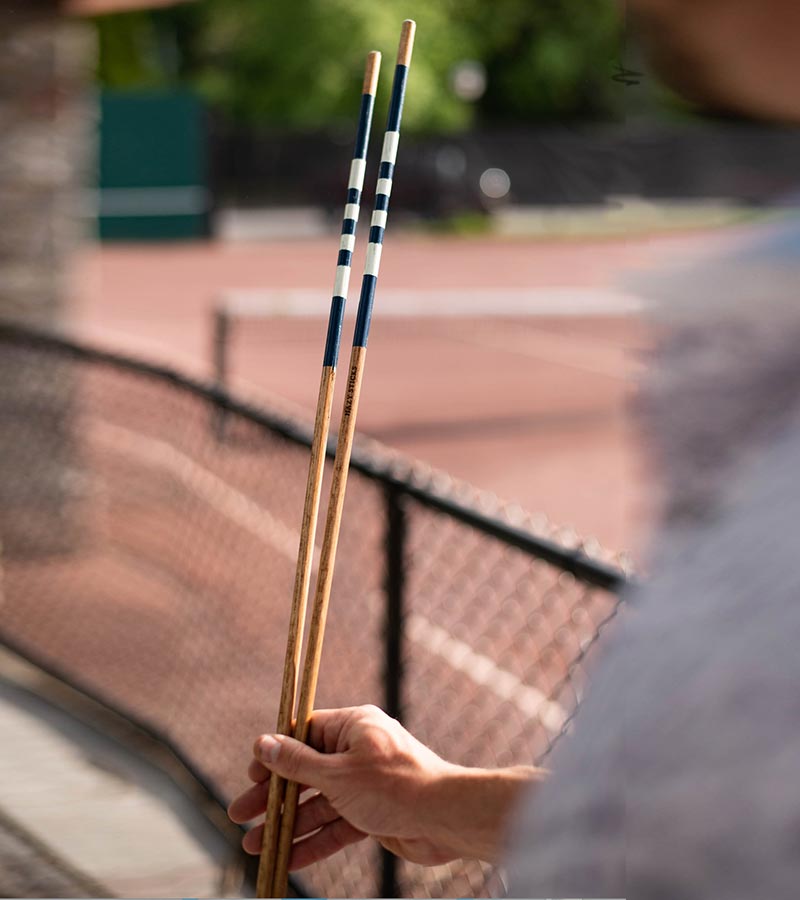 HazyGolf Alignment Sticks – The Nautical - pair vertical sticks held by golfer