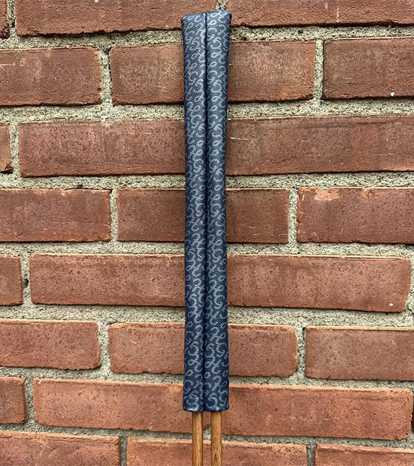 Hazy Golf All Over Alignment Sticks Cover- showing each sleeve against brick wall