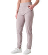 Inphorm BAILA Womens Golf Pants 29" inseam in Latte- partial model with a 3 quarter front view-hand in pocket