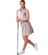 Inphorm MAI Womens Sleeveless Golf Polo w/ Razor Back - model in a skirt with club in Latte Print - front view