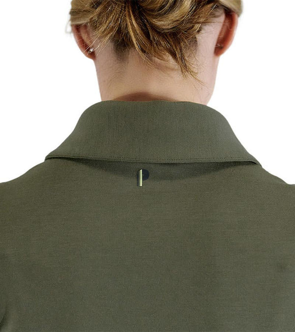 Pirdie June Daly Womens Golf Polo - in Olive Green -partial model- closeup of the Pirdie logo on the back, below the color