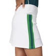 Pirdie Foreplay Skirt in White - partial model 3quarter view with kelly green/white/kelly green vertical stripe down the side of the skirt.