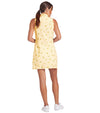 Puma Lemons Woven Womens Golf Dress- model-back view in Sunny Yellow, an allover lemon print on a cheerful yellow-and-white checkered background.