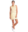 Puma Lemons Woven Womens Golf Dress- model-front view in Sunny Yellow, an allover lemon print on a cheerful yellow-and-white checkered background.