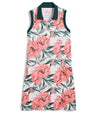 Puma MATTR Beautiful Game Womans Golf Dress in a tropical White Glow / Peach Frost print with green collar and green banded armholes - front view