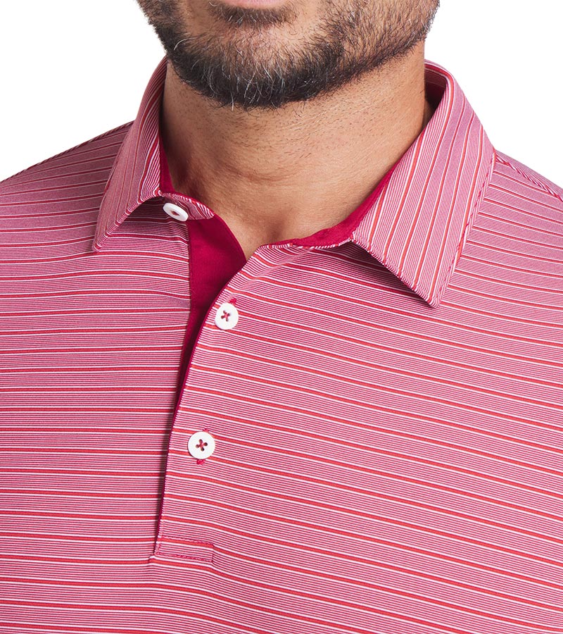 Puma Mens MATTR Bay Golf Polo Model Front in Dark Crimson / Red Fire with simple thin stripes in 2 different colors. Closeup of the collar and 3-button placket.