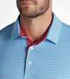 Puma Mens MATTR Bay Golf Polo Model Front in Garnet Rose / Aqua Blue with simple thin stripes in 2 different colors. Closeup of the collar and 3-button placket lined in red.