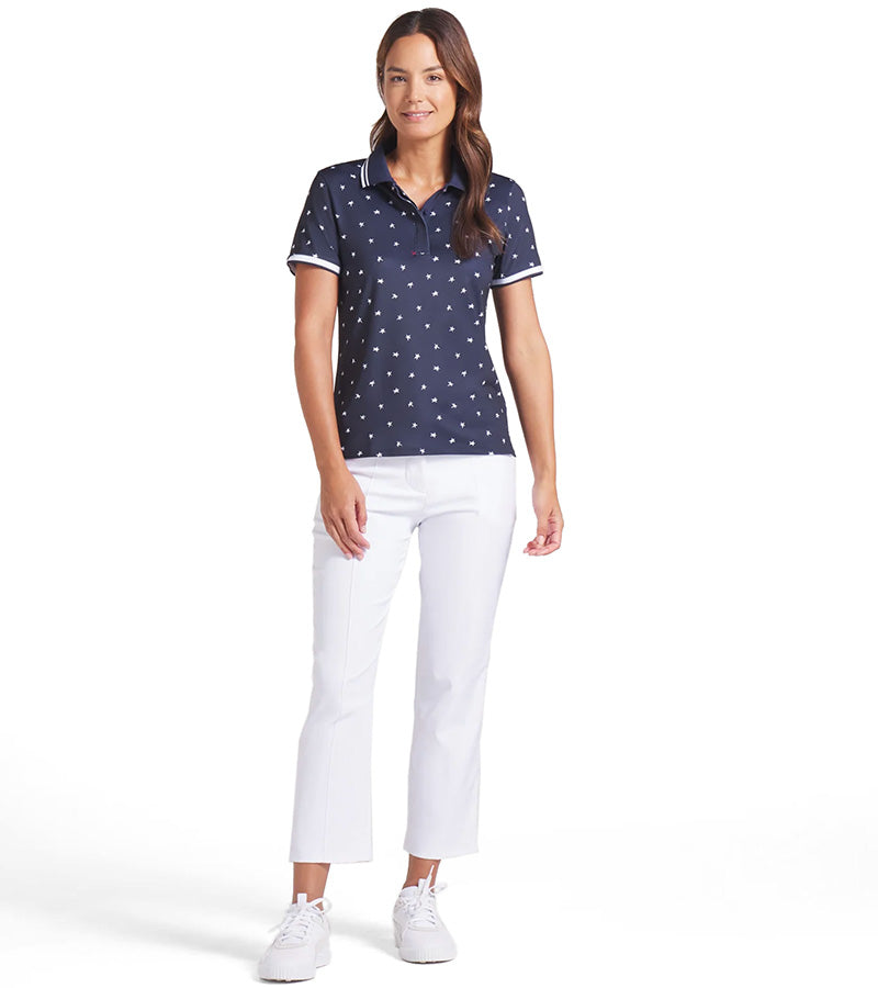 Puma Volition Dancing Stars Short Sleeve Women’s Golf Polo Shirt - model with front view in Deep Navy with white stars