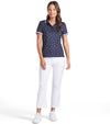 Puma Volition Dancing Stars Short Sleeve Women’s Golf Polo Shirt - model with front view in Deep Navy with white stars