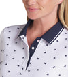 Puma Volition Dancing Stars Short Sleeve Women’s Golf Polo Shirt with closeup of button plackett and collar in White Glow with navy stars