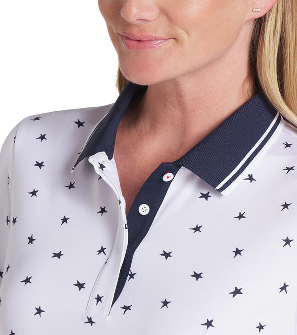 Puma Volition Dancing Stars Short Sleeve Women’s Golf Polo Shirt with closeup of button plackett and collar in White Glow with navy stars