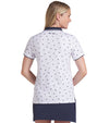 Puma Volition Dancing Stars Short Sleeve Women’s Golf Polo Shirt with partial model- back view in White Glow with navy stars