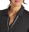 Puma Womens CLOUDSPUN Piped Golf Polo Shirt / Short Sleeve in Black Puma with a closeup of the classic collar neckline featuring piped detailing at the V neckline adding a touch of sophistication to the overall design.