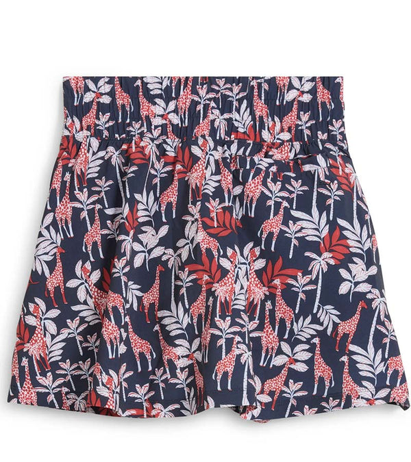 Puma Women’s Sandy Printed Golf Skirt front view in Deep Navy -a bold navy jungle print with playful red giraffes among the foliage
