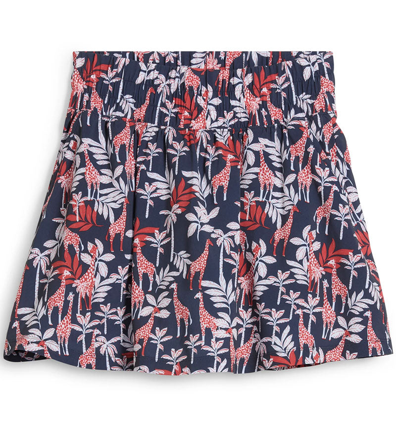 Puma Women’s Sandy Printed Golf Skirt back view in Deep Navy -a bold navy jungle print with playful red giraffes among the foliage