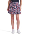 Puma Women’s Sandy Printed Golf Skirt - partial model front view in Deep Navy -a bold navy jungle print with playful red giraffes among the foliage