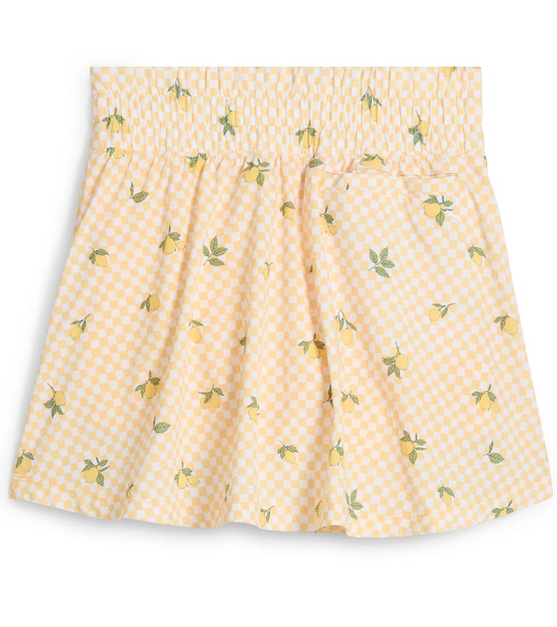 Puma Womens Sandy Printed Golf Skirt in Sunny Yellow, a print of tossed yellow lemons and green leaves against a gingham background - back view of partial model