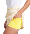 Puma Womens Sandy Printed Golf Skirt in Sunny Yellow, a print of tossed yellow lemons and green leaves against a gingham background - closeup of under shorts side pocket