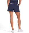 Puma x AP Solid Women’s Golf Shorts- partial model -back in Deep Navy with contrast white piping on the pockets