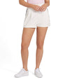 Puma x AP Solid Women’s Golf Shorts- partial model -front in Warm White with contrast navy piping on the pockets