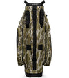 Sunday Golf The Big Rig Golf Cart Bag in Mossy Oak Bottomland Camo with black accents on details like zippers, base and top club divider -back view with black padded carrying strap.