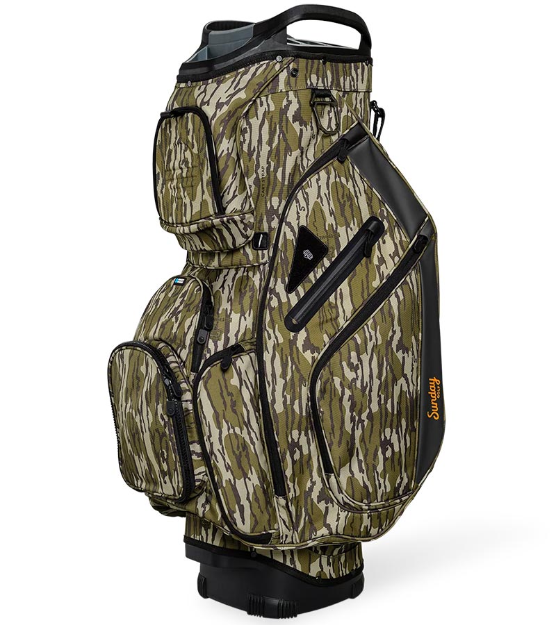 Sunday Golf The Big Rig Golf Cart Bag in Mossy Oak Bottomland Camo with black accents on details like zippers, base and top club divider showing a three quarter front/side view