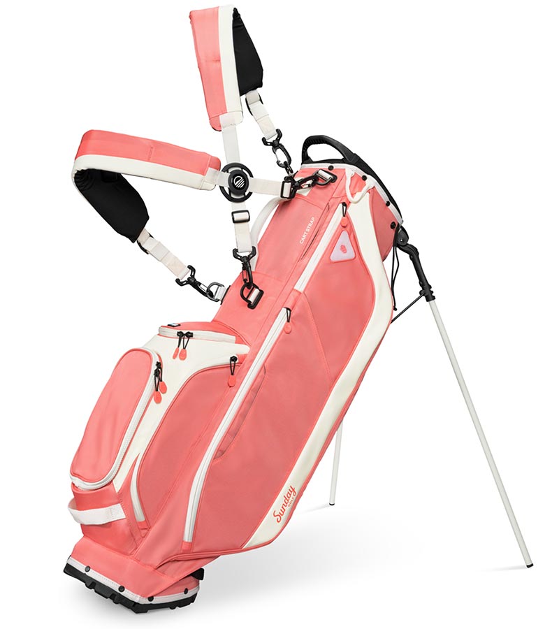 Sunday Golf Ryder Full Size Stand Golf Bag in Coral with legs extended and a backpack-style double strap system