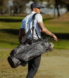 Sunday Golf Ryder S-Class Full Size Stand Golf Bag in Black Vegan Leather – male golfer owalking the links