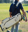 Sunday Golf Ryder S-Class Full Size Stand Golf Bag in Cream Vegan Leather – male golfer on course