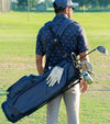 Sunday Golf Ryder S-Class Full Size Stand Golf Bag in Navy Vegan Leather – male golfer on course