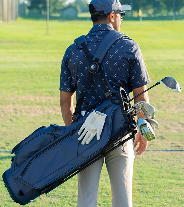 Sunday Golf Ryder S-Class Full Size Stand Golf Bag in Navy Vegan Leather – male golfer on course