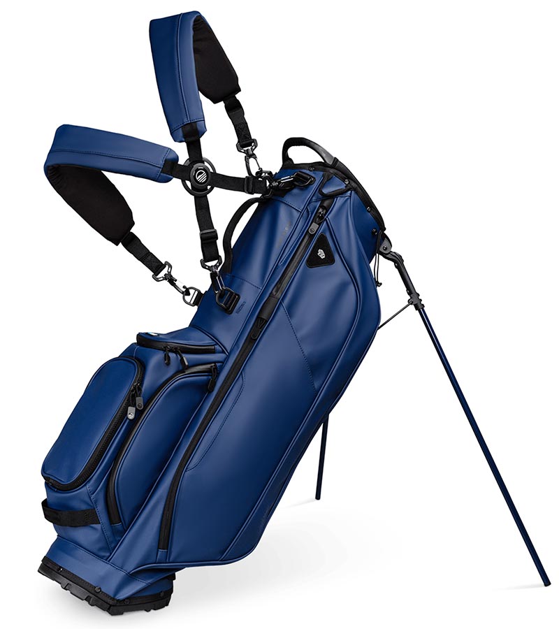 Sunday Golf Ryder S-Class Full Size Stand Golf Bag in Navy Vegan Leather with legs extended and a backpack-style double strap system