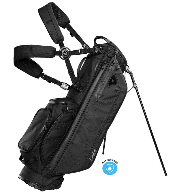 Sunday Golf Ryder Waterproof Full Size Stand Golf Bag in Storm Black with legs extended and a backpack-style double strap system