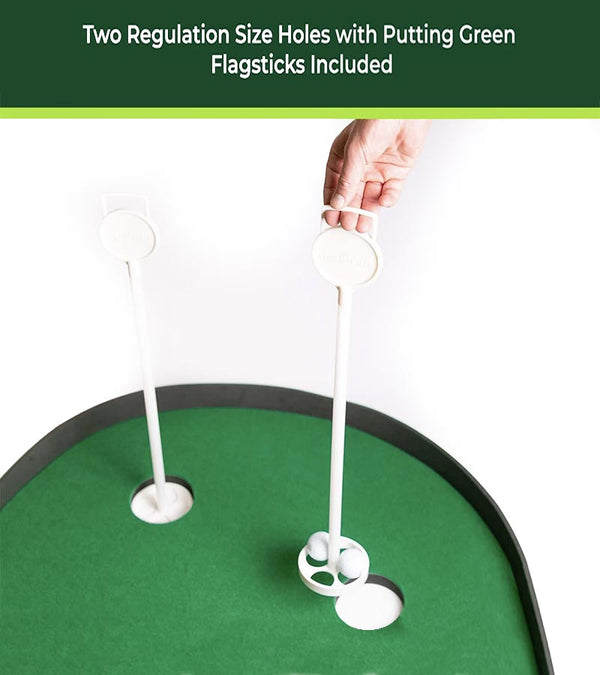 TrueBirdie XL Indoor Professional Putting Mat - closeup of the putting flags. Hand lifting the putting flag with its base holding 2 golf balls