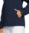 Puma DRYLBL Women's Rain Golf Jacket in navy - closeup detail cuff & front zippered pocket