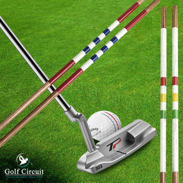 Golfer addressing ball on green with 2 sets of alignment sticks