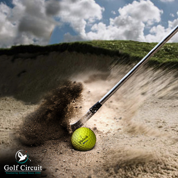 Close up of a bunker shot with yellow Volvik ball