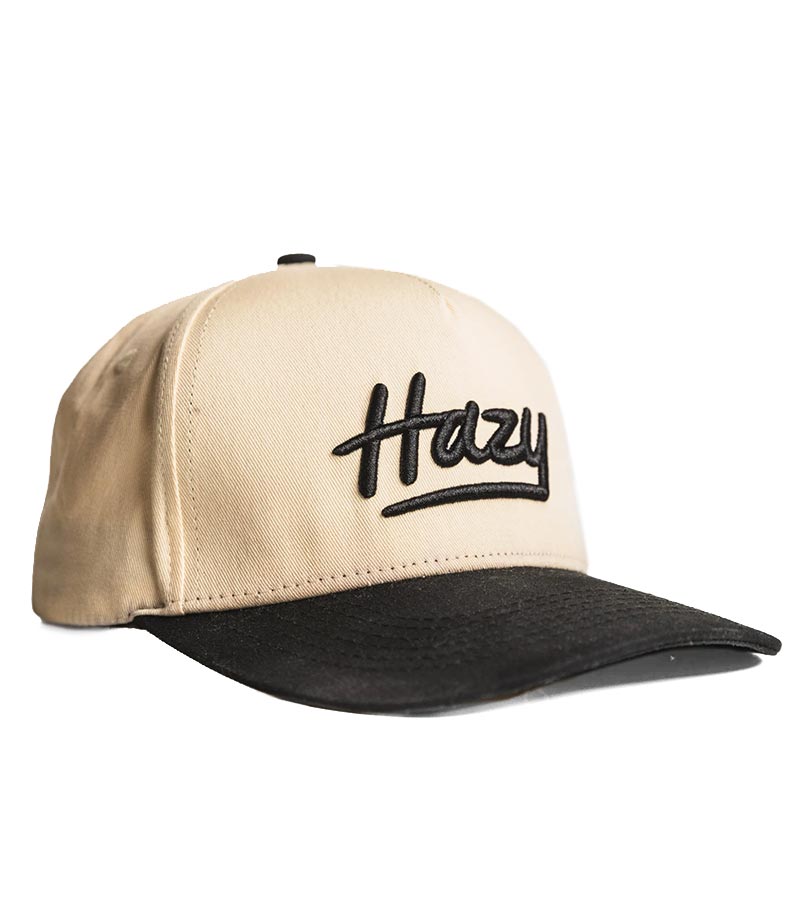 Hazy Golf’s Portland Tone Black and Bone Snapback - 3-quarter front view facing left with black visor and Hazy logo across the front of the crown,