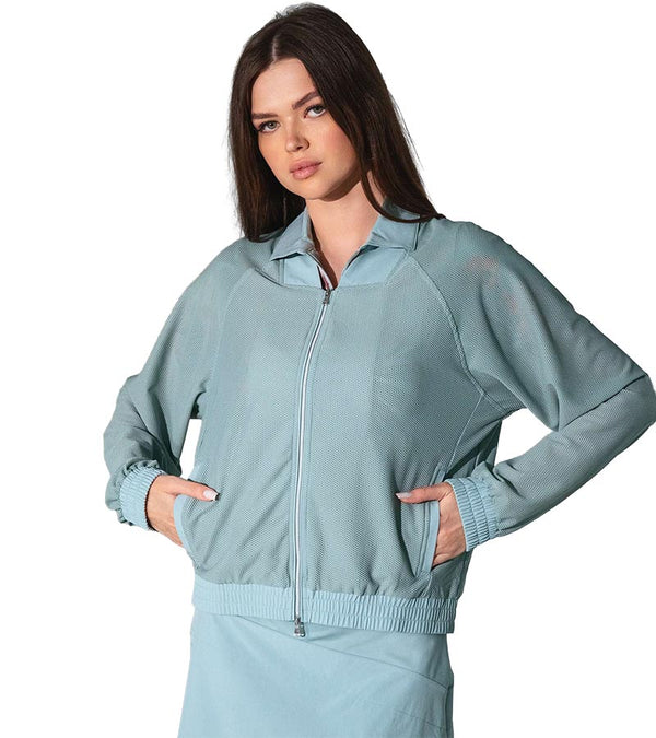 inPhorm BAILA Mesh 2 Way Zip Womens Bomber Golf Jacket with model in Veridian Green- front view with hands in pockets