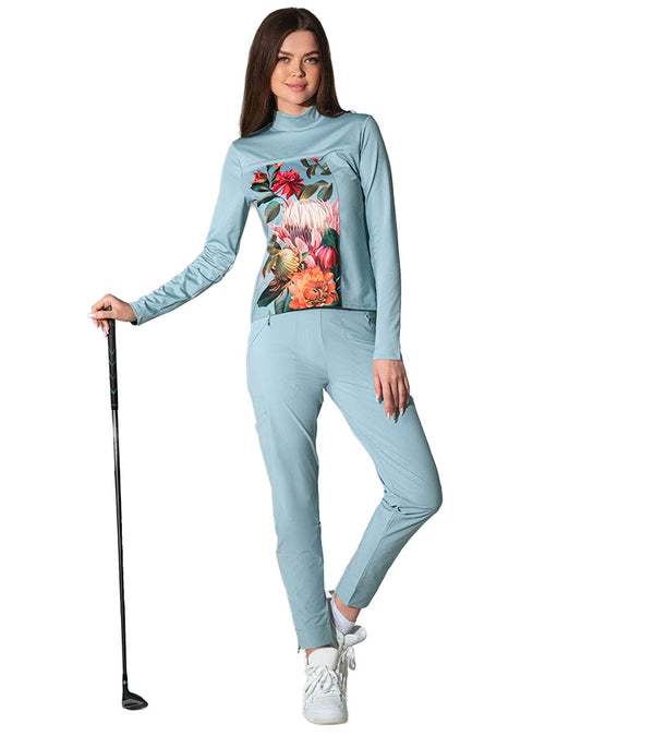 Inphorm BAILA Womens Golf Pants 29" inseam in Veridian Green- model  holding club front view