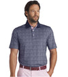 Puma Mens AP MATTR Iced Tea Golf Polo Shirt Model Front in Deep Navy with a unique, intricate iced tea graphic set pattern of diagonal rows of tiny ice tea glasses with a slice of lemon and a straw to create an all over pattern effect.